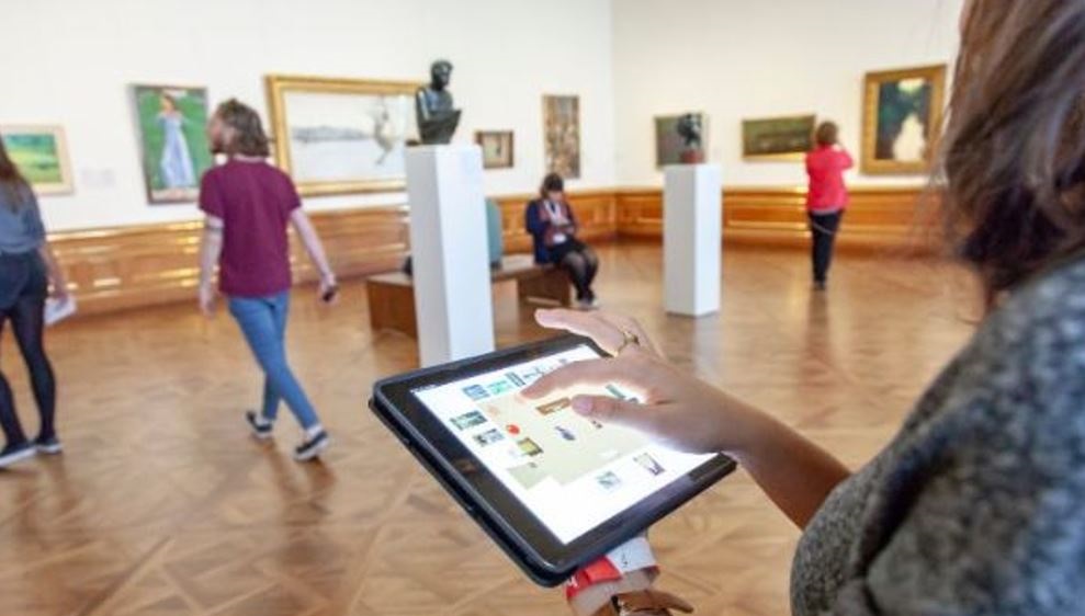 Woman with ipad in museum