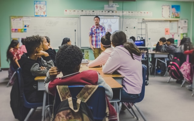 teacher standing in front of a class