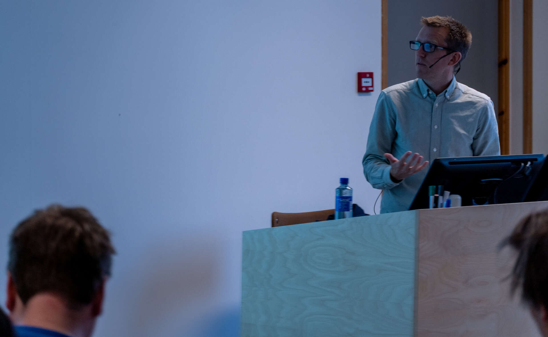 Man giving lecture in a classroom.