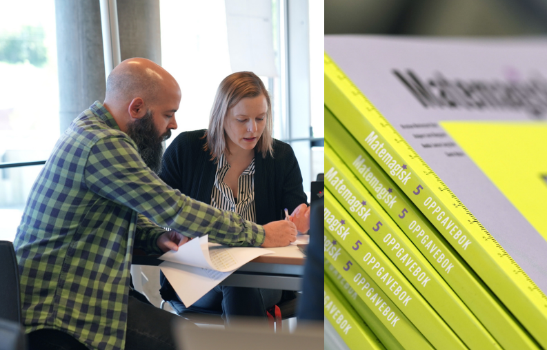 Two teachers looking at a book together