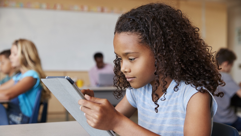 Girl with tablet. Illustration photo.