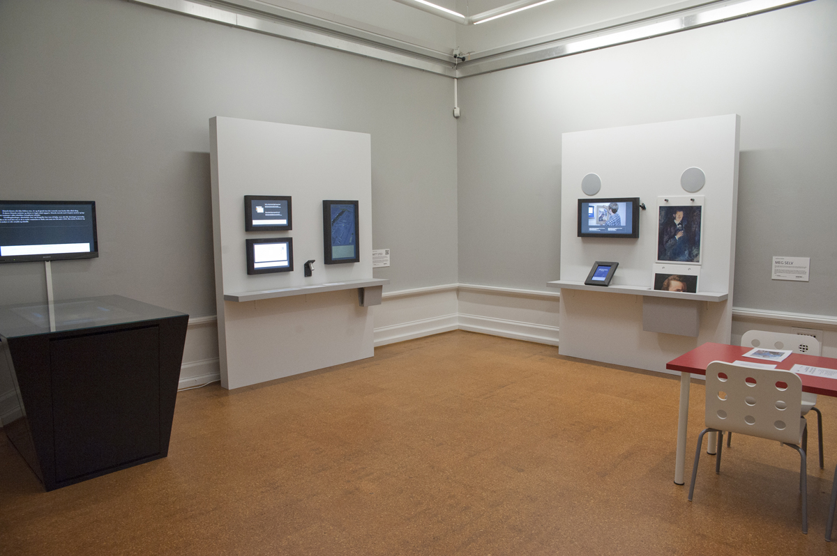 Multiple screens on walls in museum