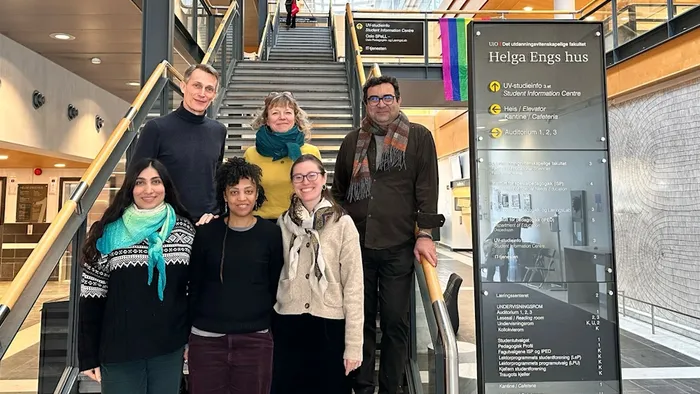 Photo of the project group standing in the stairs