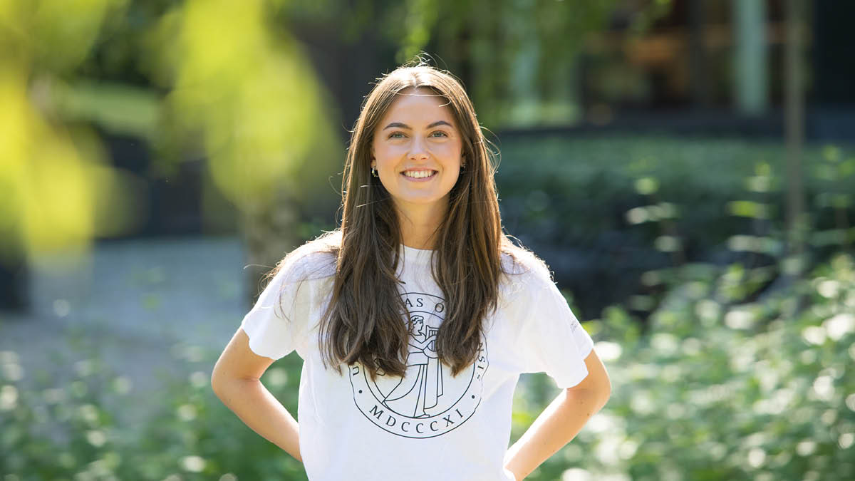 Student on green background
