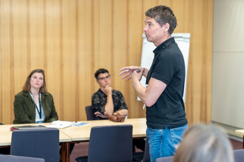 Shirt ,Table ,Chair ,Interaction ,Public speaking.